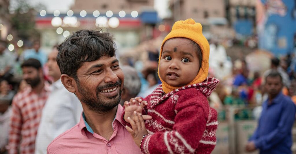 家族とゲームを通じて自己肯定感を育てる幼児。笑顔で親と向き合い、自信を持った表情を見せている子どもの姿