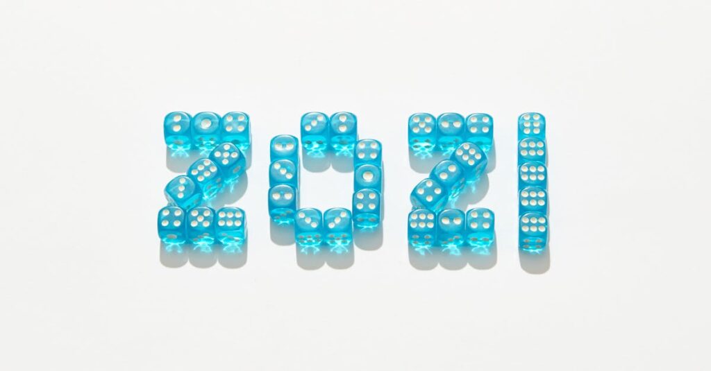 年末年始に家族全員でボードゲームを楽しみ、笑顔と会話があふれるリビングの風景。