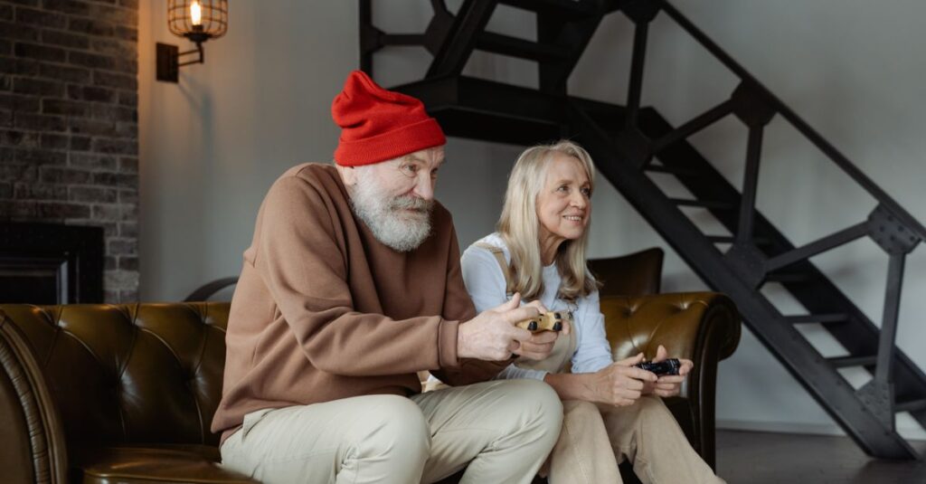 祖父母を含む家族が、簡単で楽しいボードゲームを楽しんでいる。笑顔と会話が絶えないリビングの様子。
