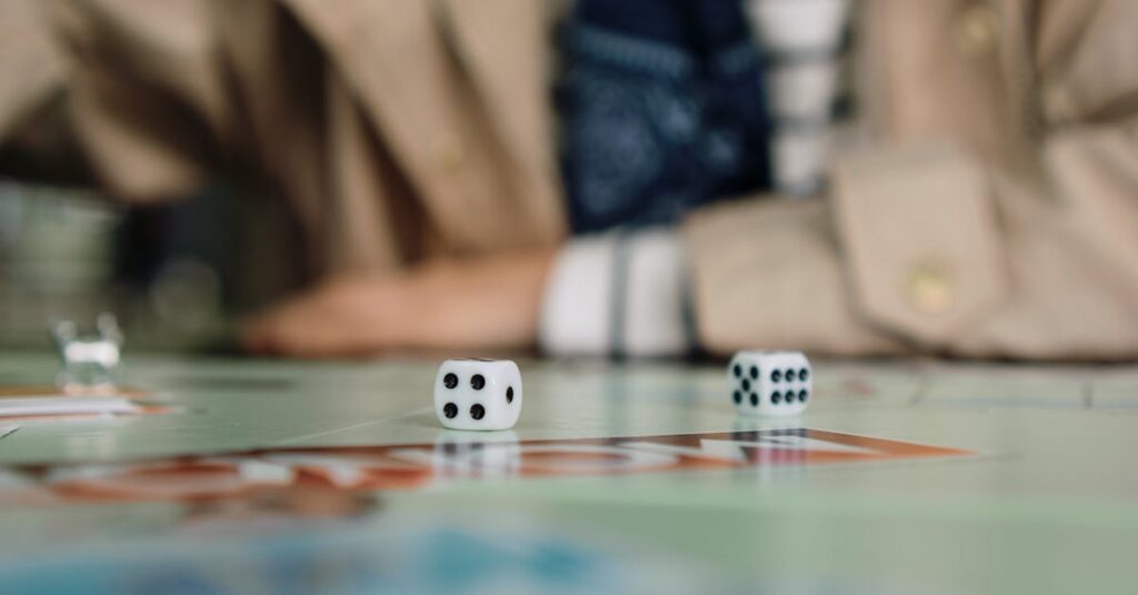 室内ゲームを選ぶ家族の様子。複数のカードゲームやボードゲームをテーブルに広げて相談しているシーン。