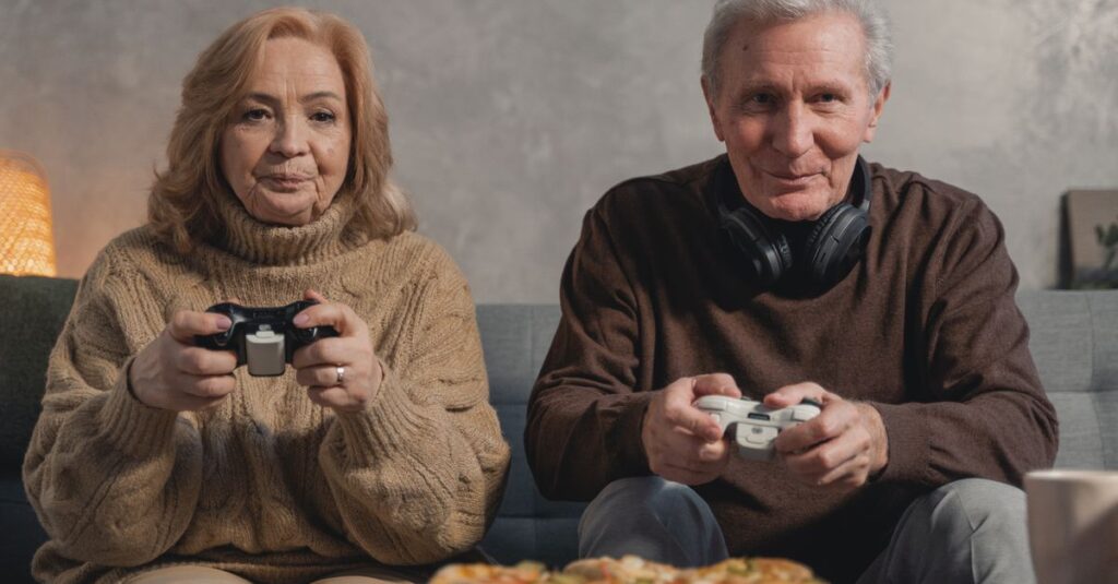 家族全員がリビングでゲームを楽しみ、笑顔でコントローラーやカードを操作している様子。