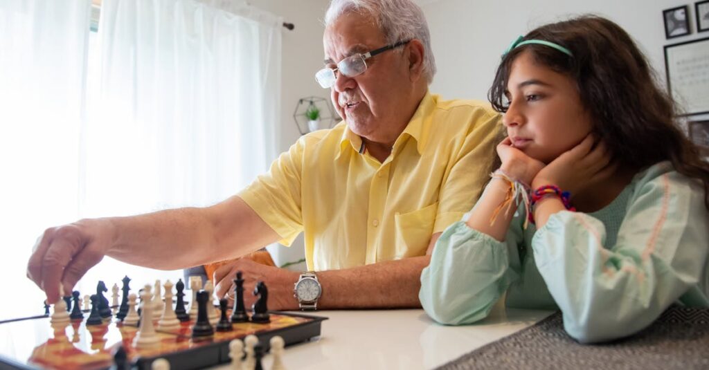 自宅でボードゲームを選んでいる様子。箱やカードを手に取って比較する場面